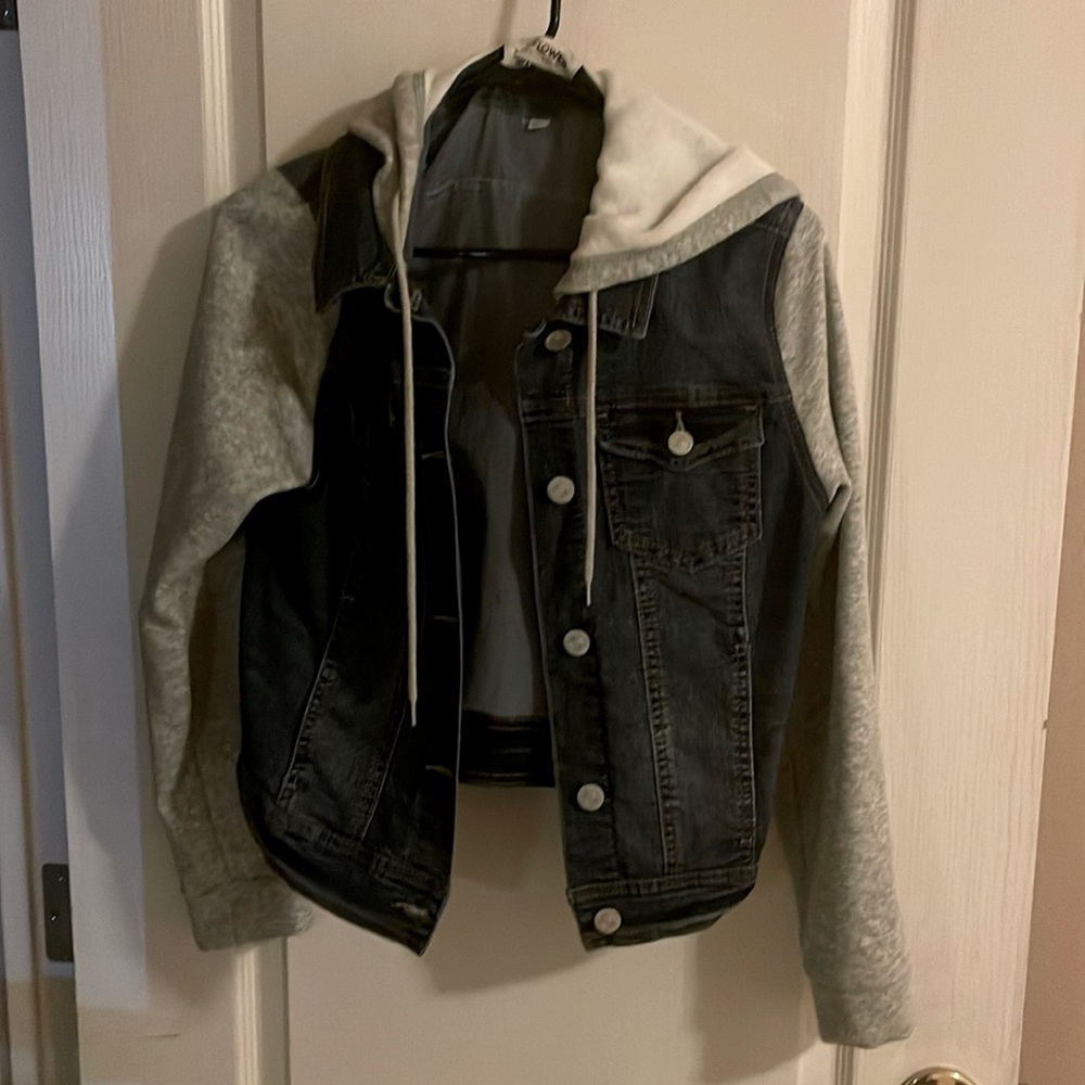 Cute kids or preteens jean jacket with hood.  Button up.  Never worn.